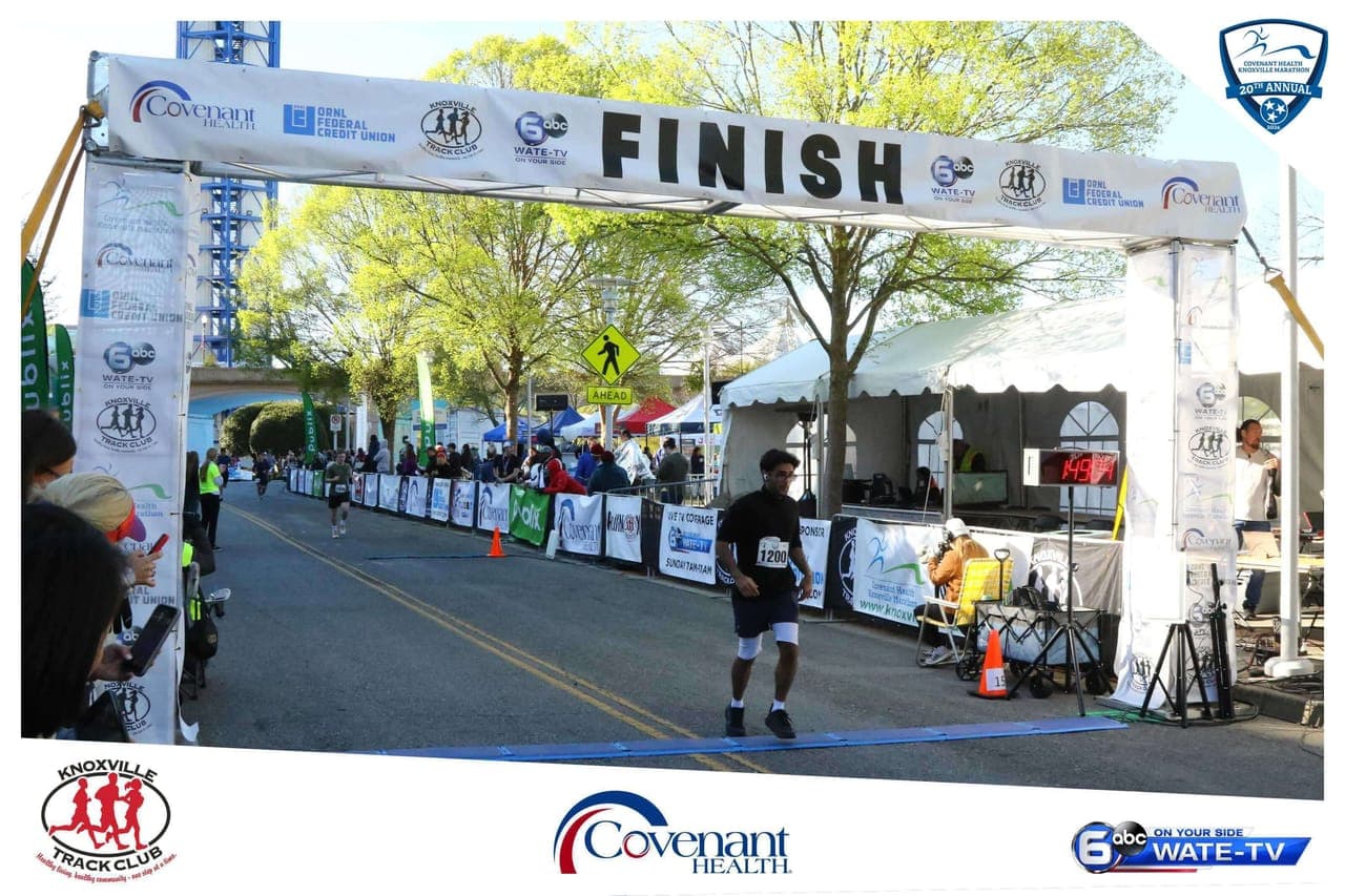 Tanishq crossing the finish line at the Knoxville Marathon
